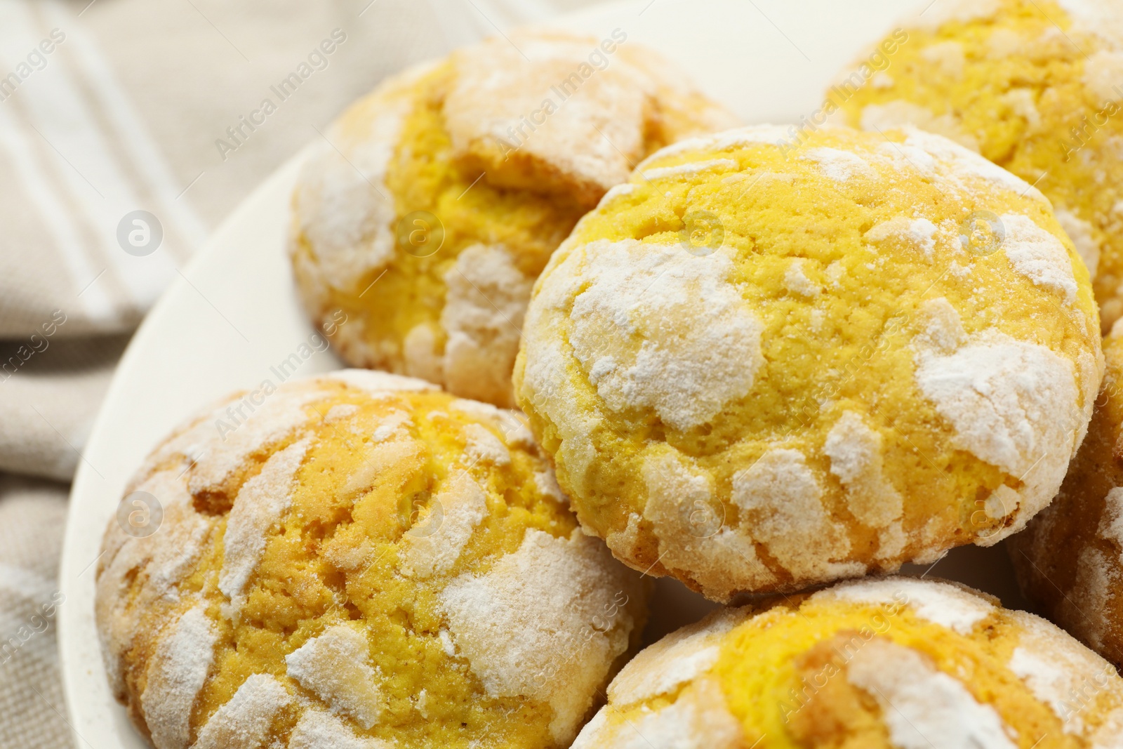 Photo of Tasty homemade lemon cookies on plate, closeup