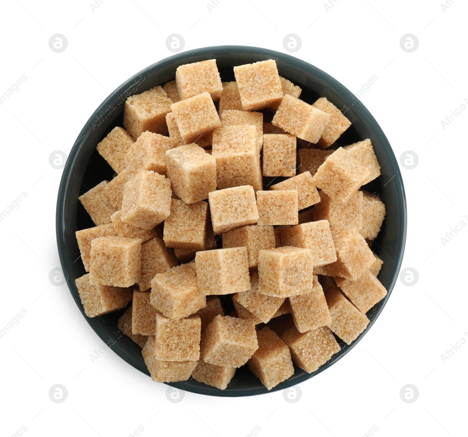 Photo of Bowl with cubes of brown sugar isolated on white, top view