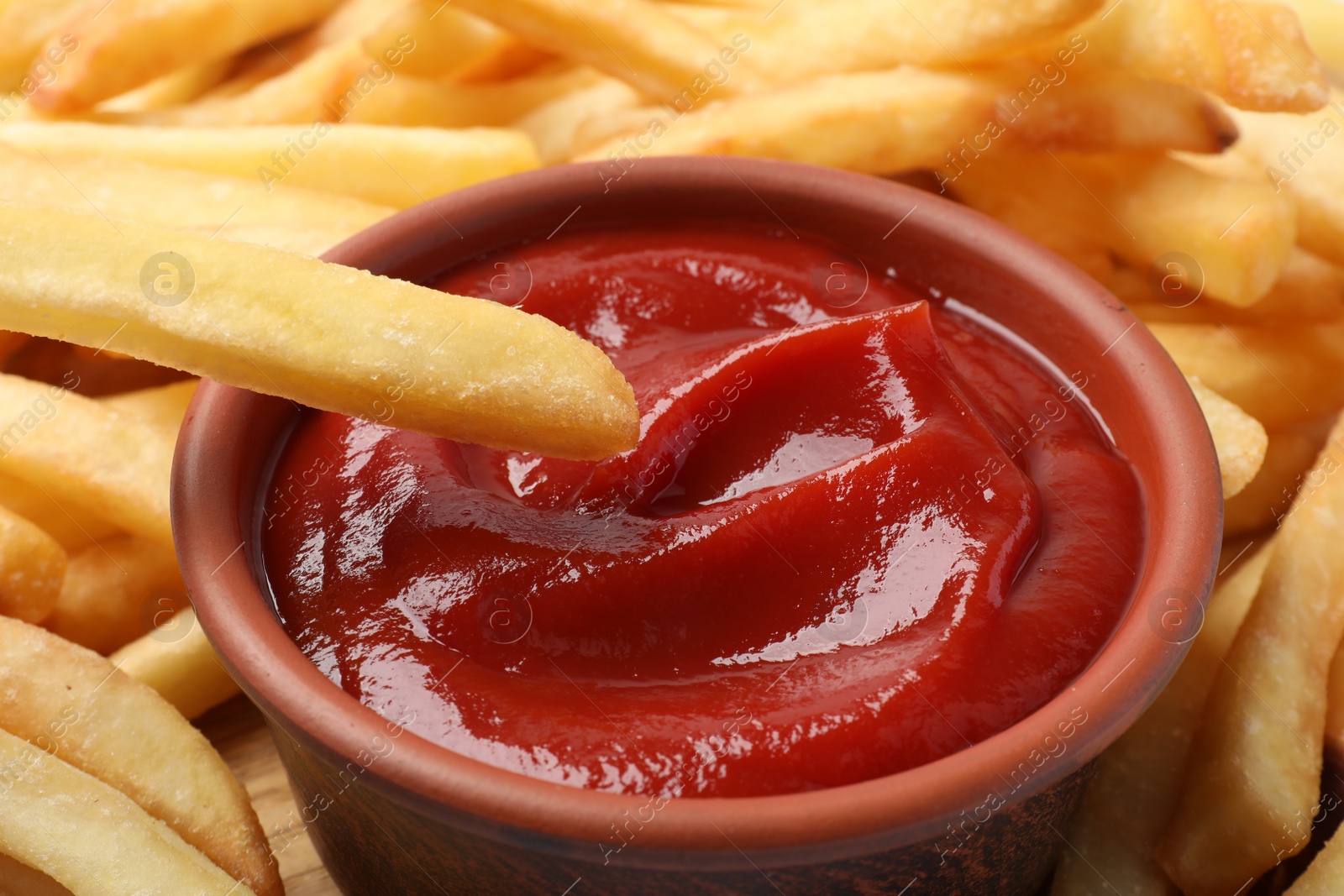Photo of Closeup view of delicious french fries with ketchup