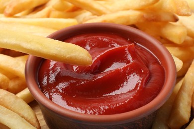 Photo of Closeup view of delicious french fries with ketchup