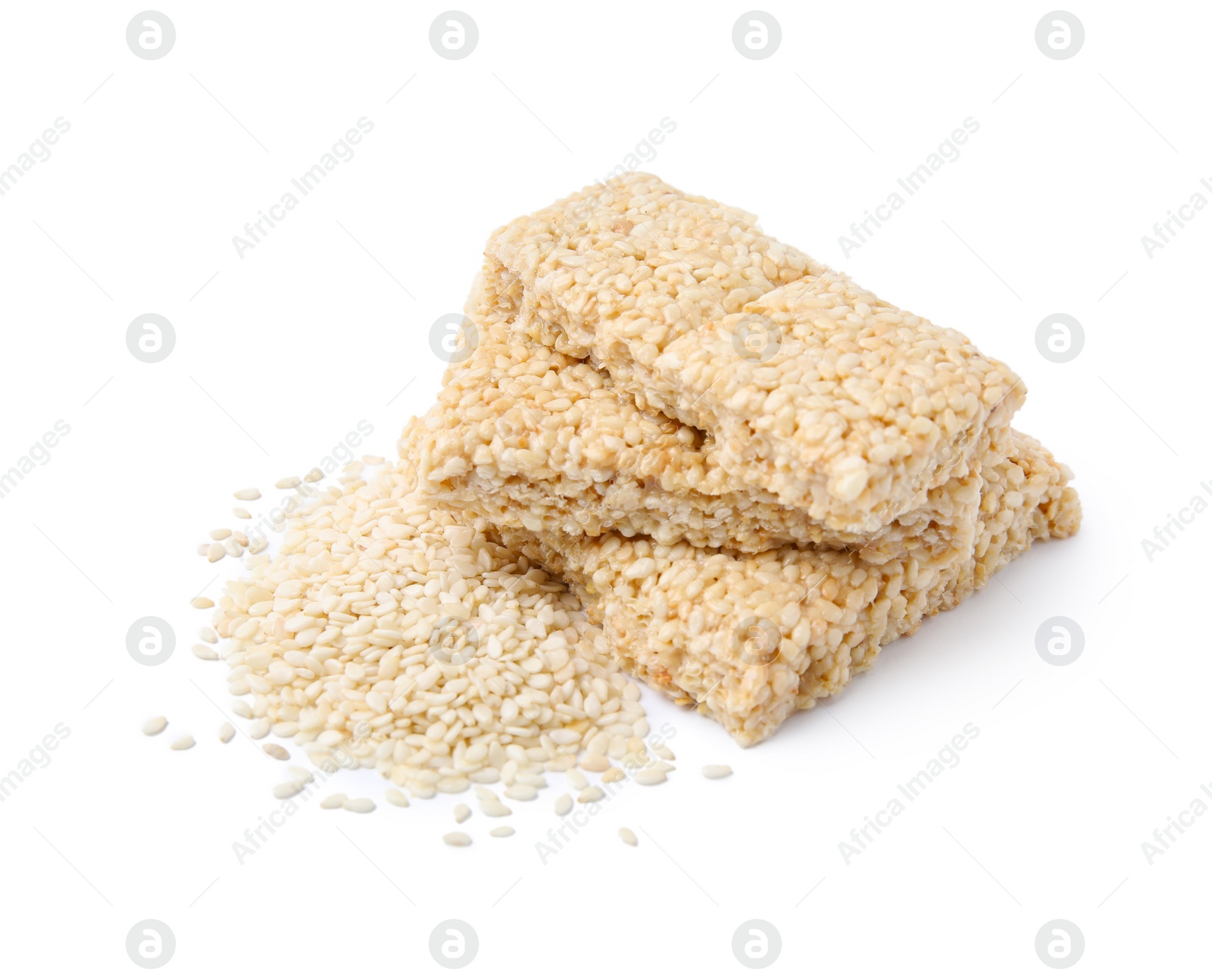 Photo of Delicious sweet kozinaki bars and sesame seeds on white background