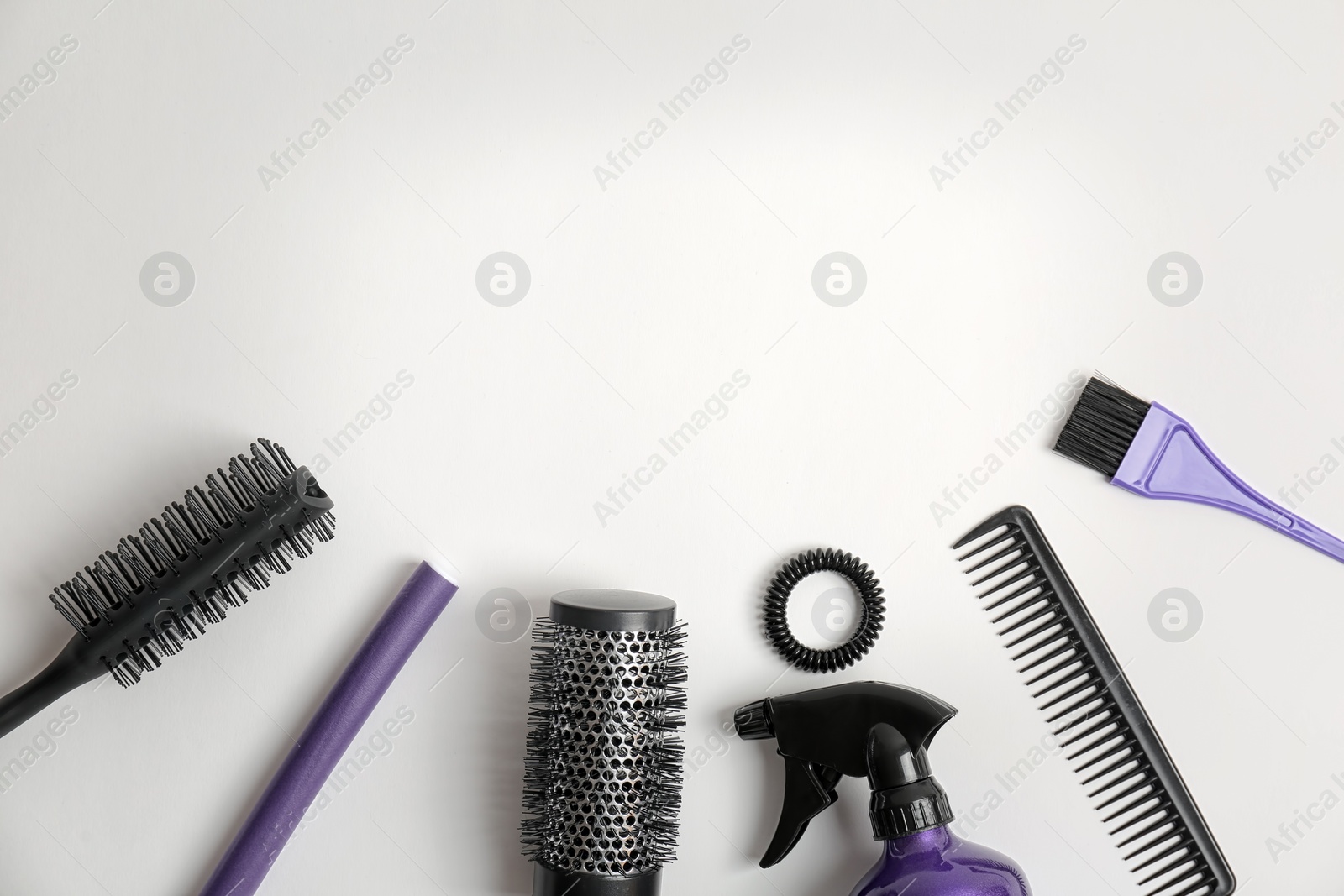 Photo of Professional hairdresser tools on white background