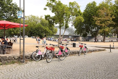 Photo of Cologne, Germany - August 28, 2022: Beautiful view of city street with people and parked bikes