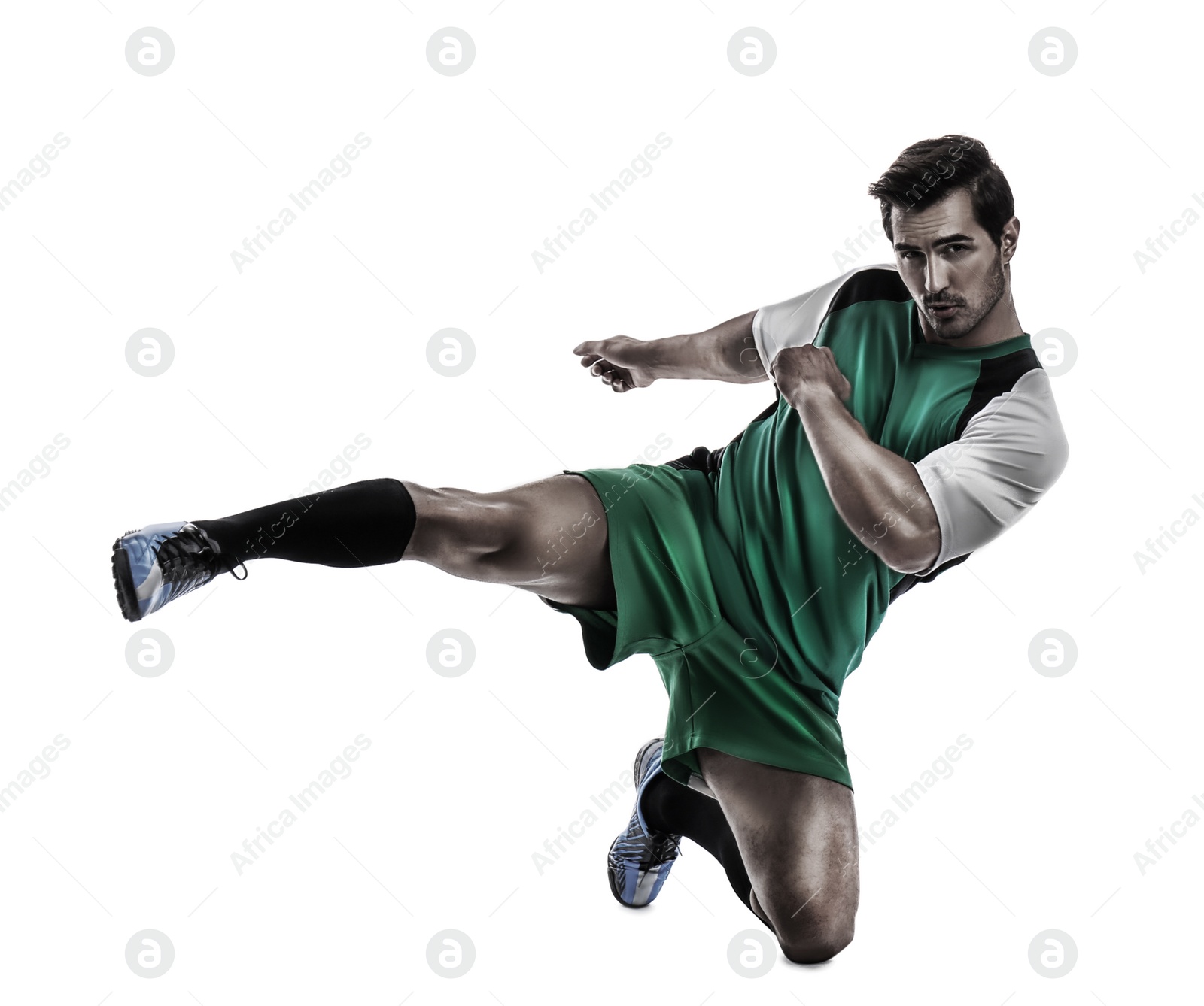 Image of Young man playing football on white background