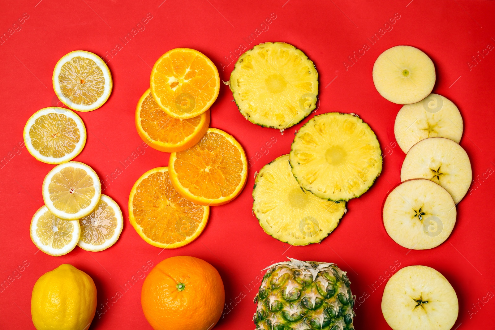 Photo of Rainbow composition with fresh fruits on color background, flat lay