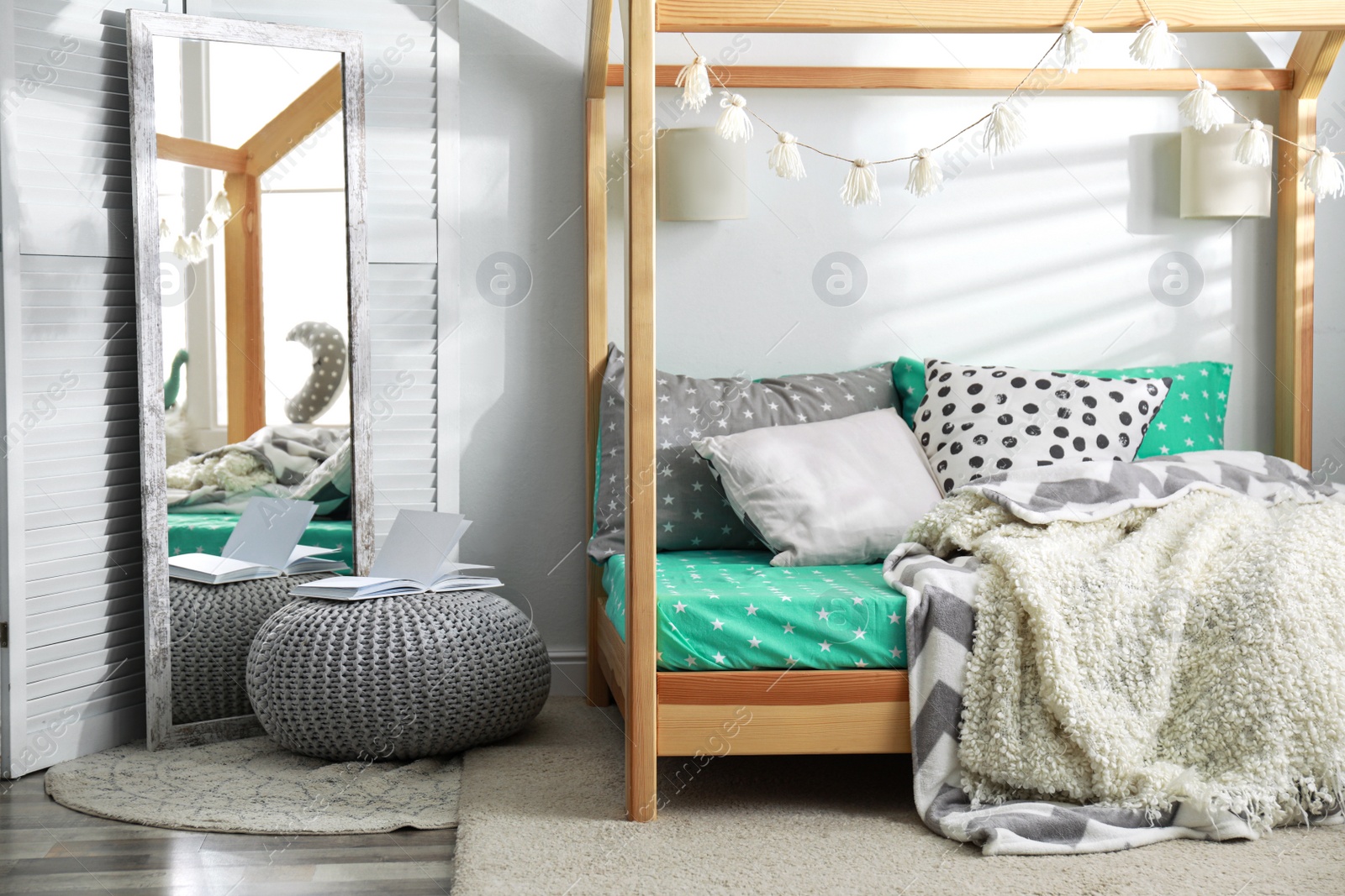 Photo of Cozy child room interior with comfortable bed