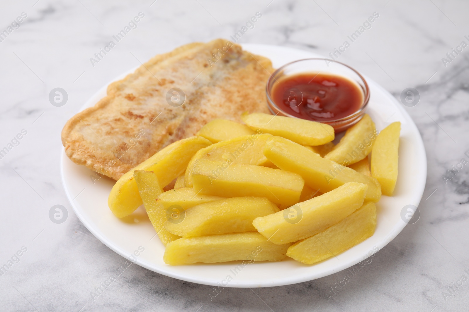 Photo of Delicious fish and chips with ketchup on light marble table, closeup