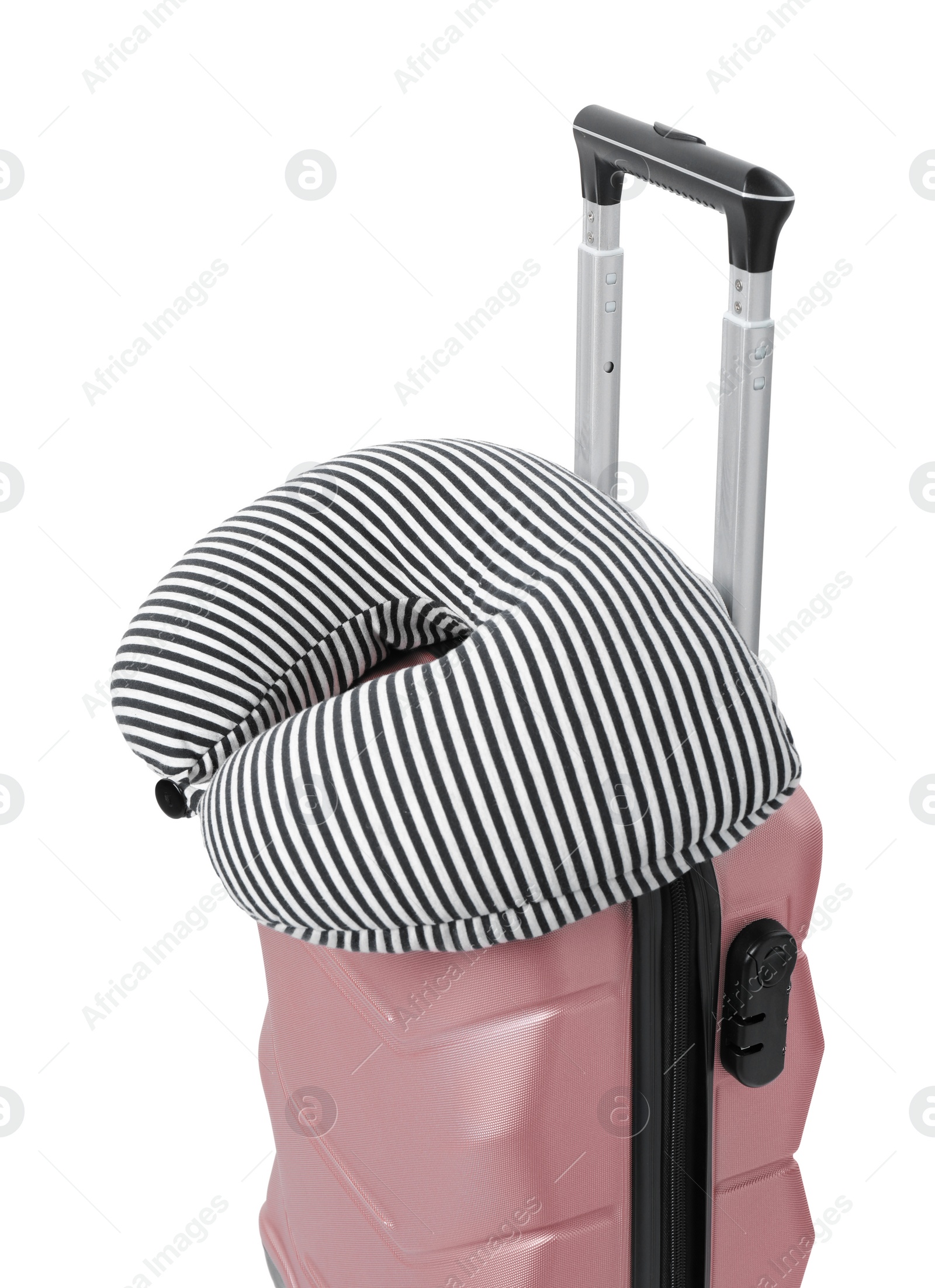 Photo of Soft travel pillow on suitcase isolated on white