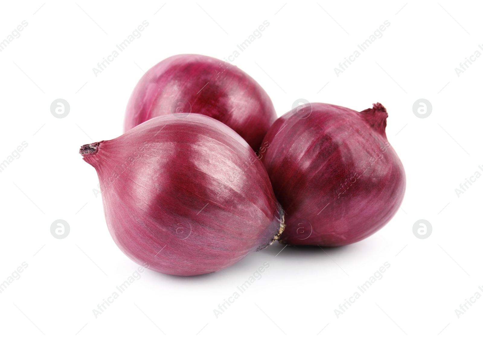 Photo of Fresh whole red onions on white background