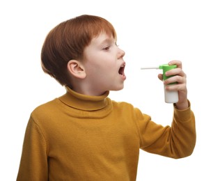 Photo of Little boy using throat spray on white background