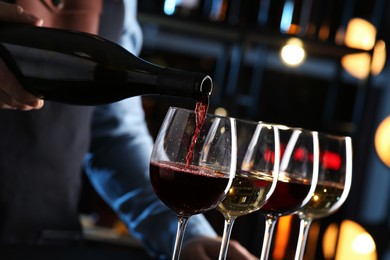 Photo of Bartender preparing wine tasting set indoors, closeup