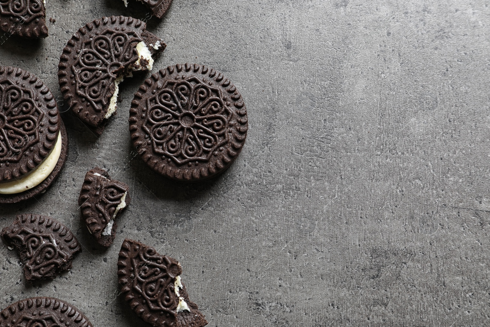 Photo of Tasty chocolate cookies on grey background, flat lay with space for text