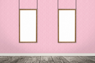 Image of Frames with empty canvases on wall in modern art gallery. Space for design