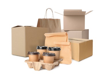 Image of Set with different cardboard boxes, paper bags and takeaway cups on white background