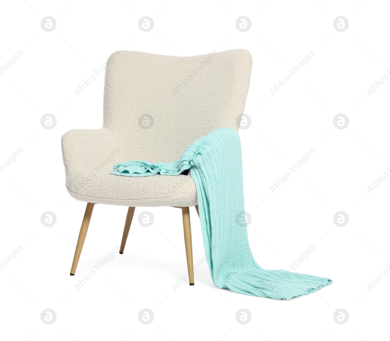 Photo of One stylish comfortable armchair with blanket isolated on white