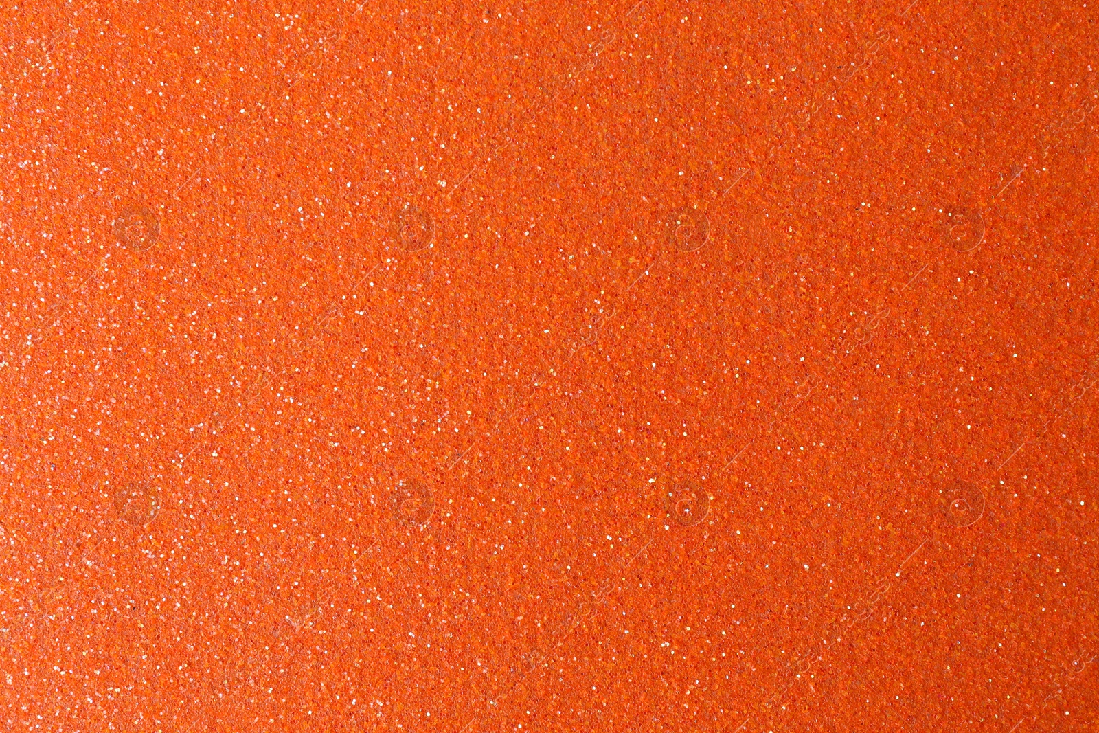 Photo of Orange textured surface as background, closeup view