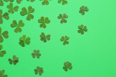 Photo of Beautiful clover on green background, flat lay