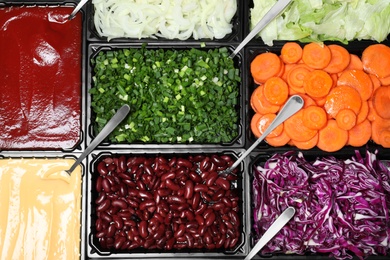 Photo of Salad bar with different fresh ingredients as background, top view