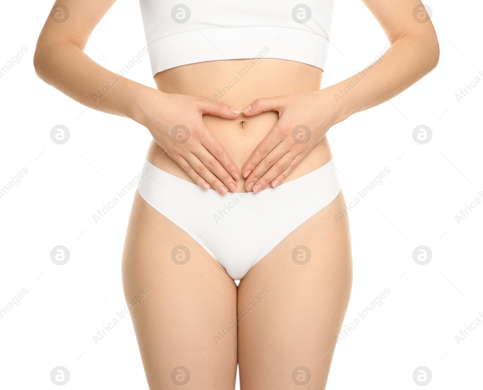 Photo of Gynecology. Woman in underwear making heart with her hands on white background, closeup