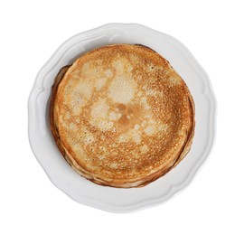 Photo of Stack of delicious crepes on plate against white background, top view