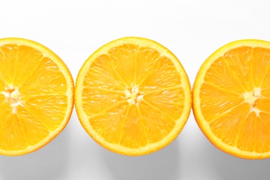 Juicy oranges on white background, top view