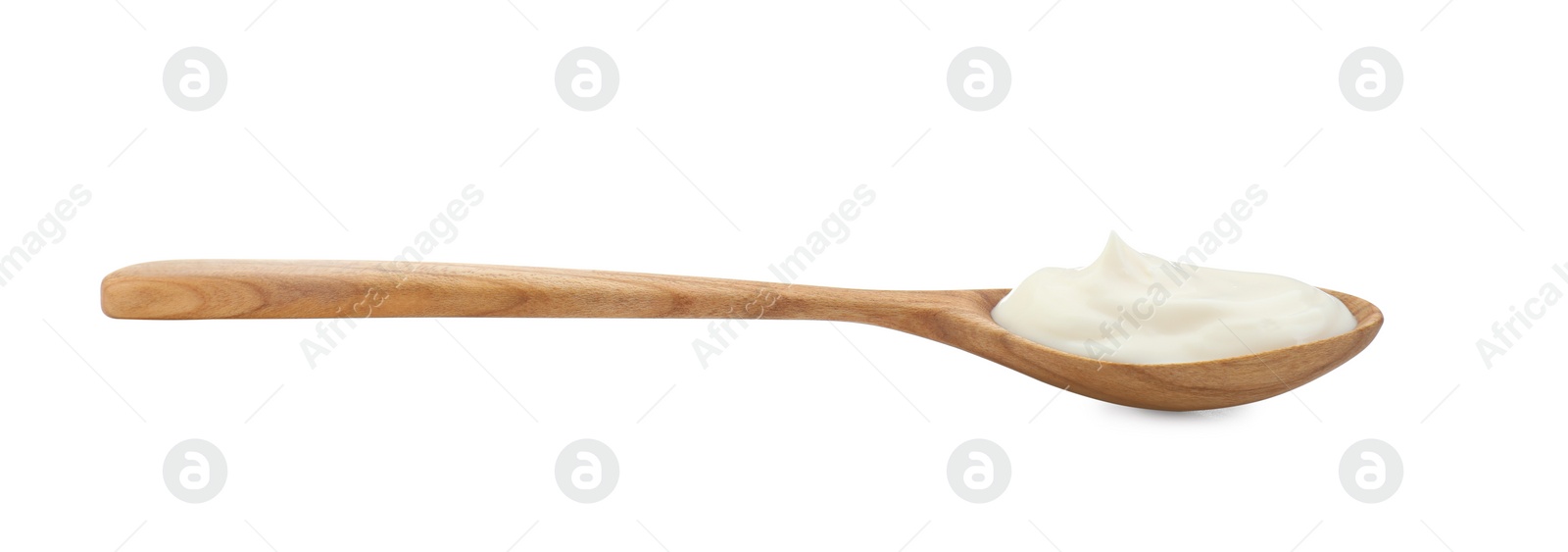 Photo of One wooden spoon with mayonnaise isolated on white