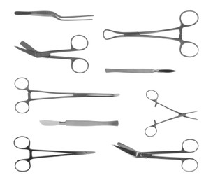 Set with different surgical instruments on white background 