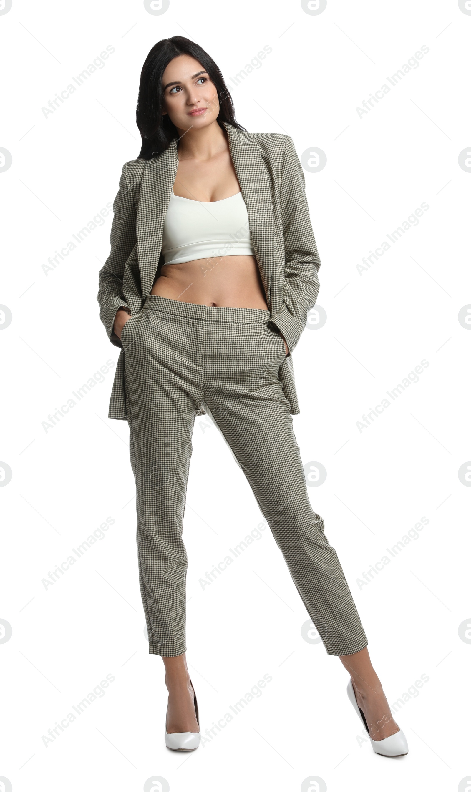 Photo of Full length portrait of beautiful woman in formal suit on white background