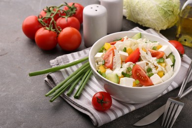 Photo of Tasty salad with Chinese cabbage served on grey table