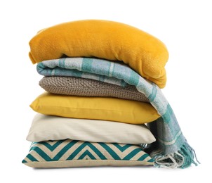 Stylish soft pillows and blankets on white background