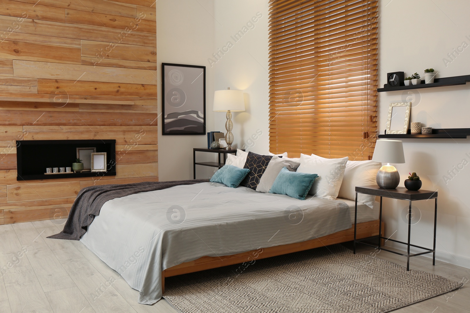 Photo of Stylish room interior with big comfortable bed