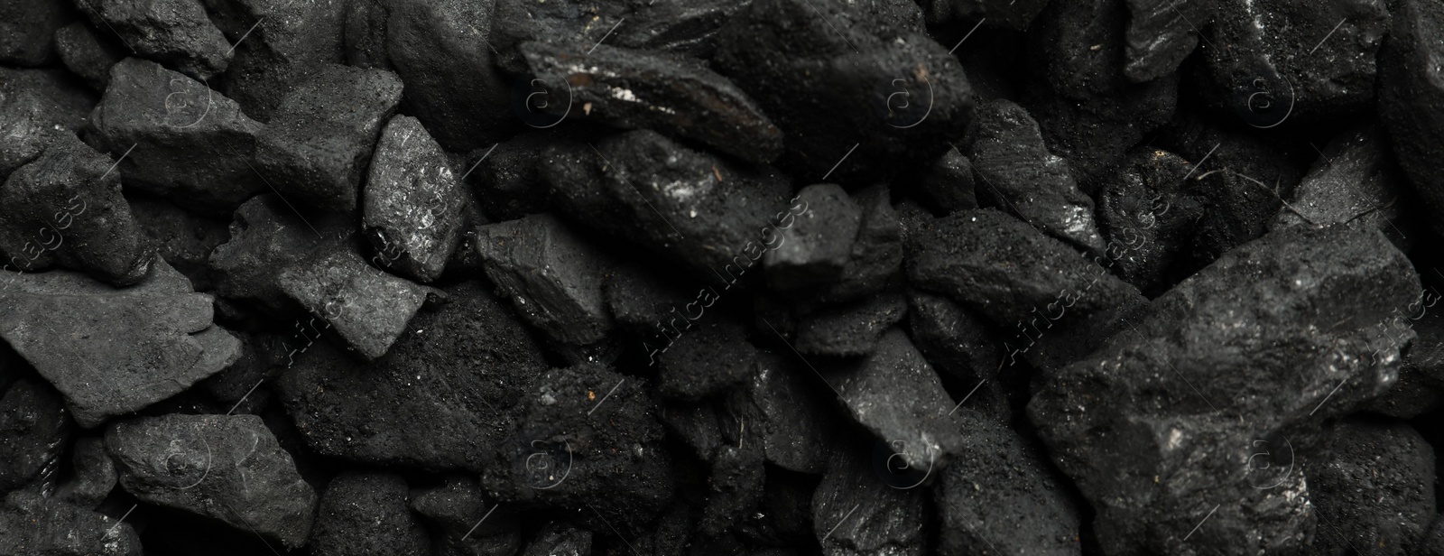 Photo of Heap of coal as background, top view