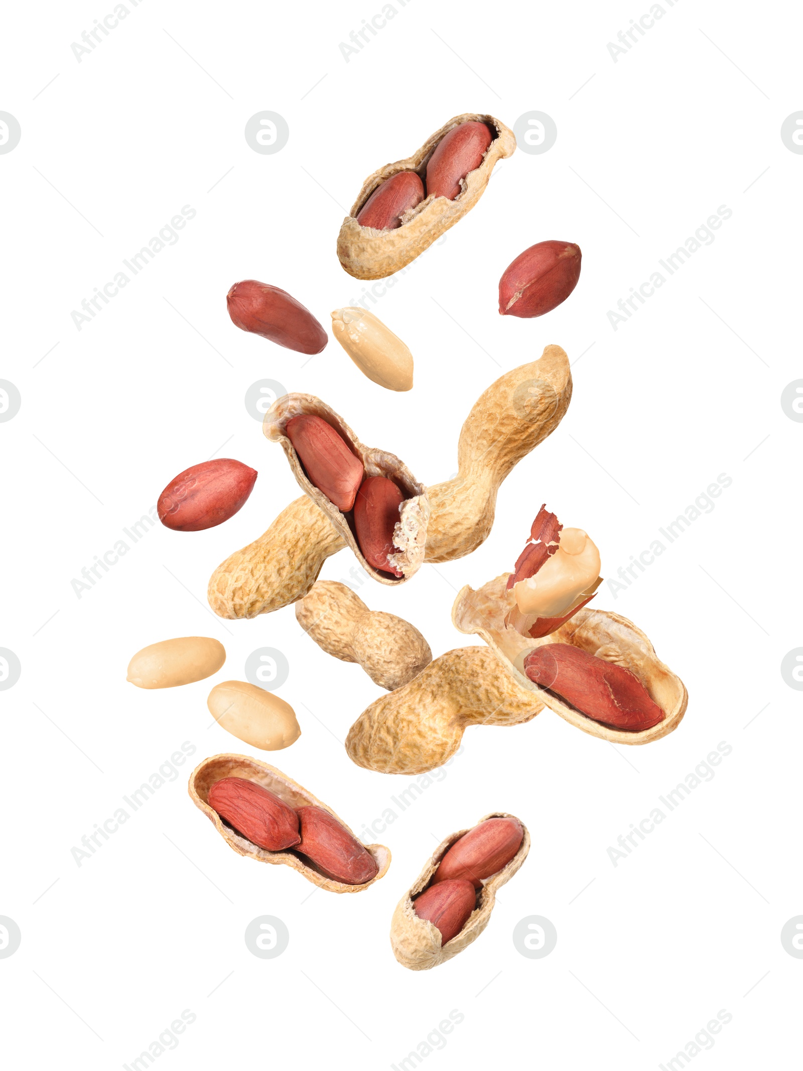 Image of Many peanuts in air on white background