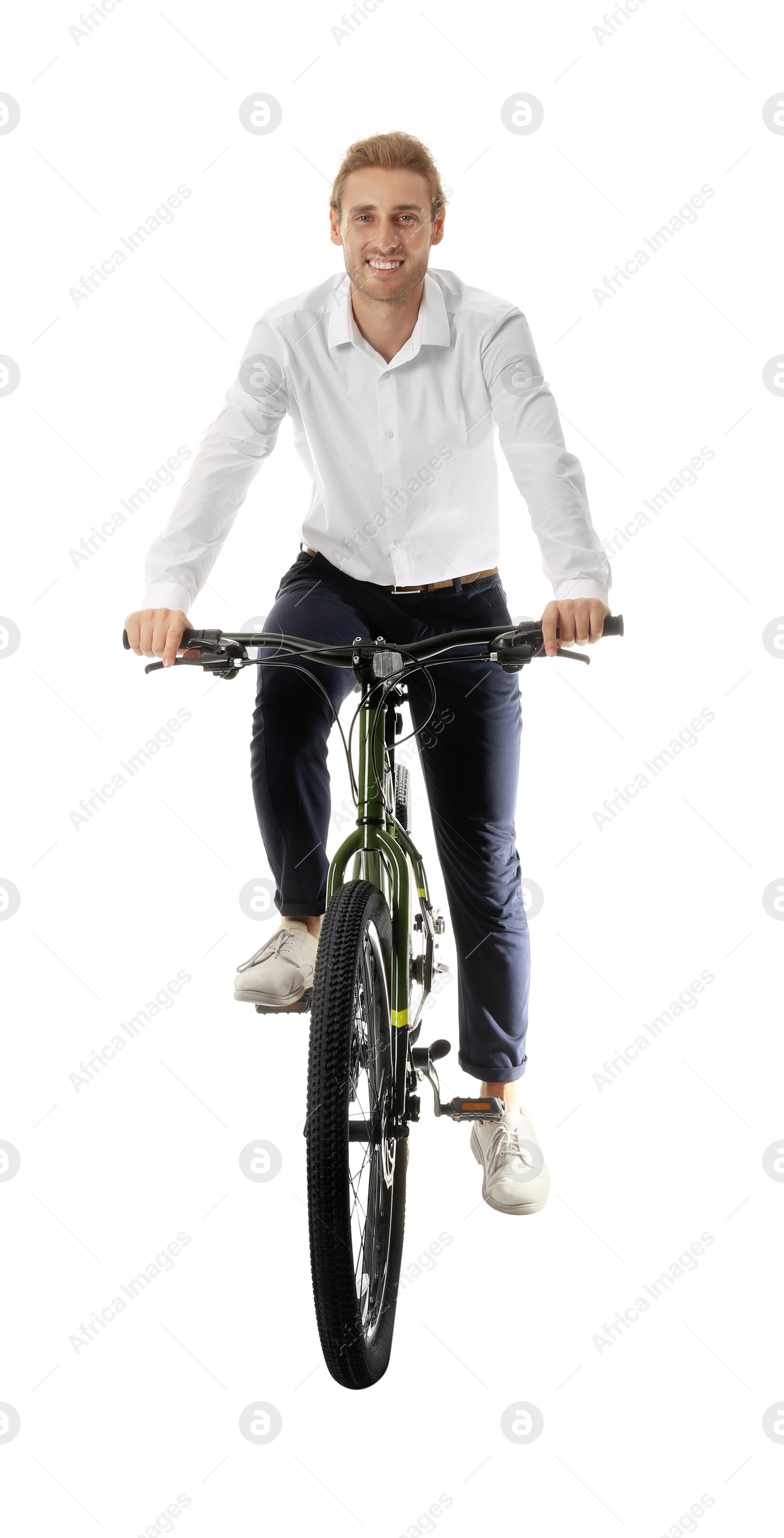 Photo of Happy young man riding bicycle on white background