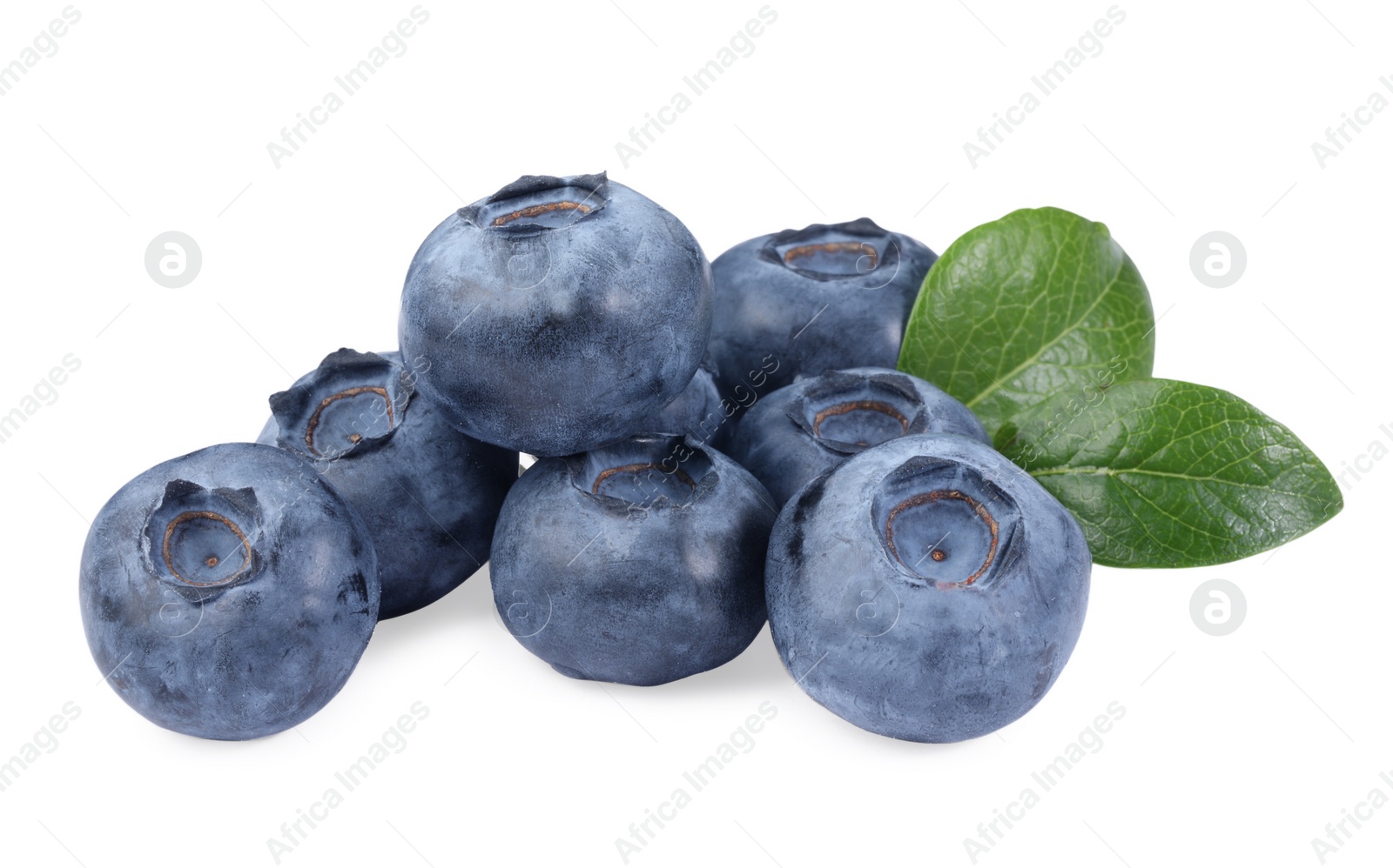 Photo of Pile of fresh ripe blueberries and leaves isolated on white