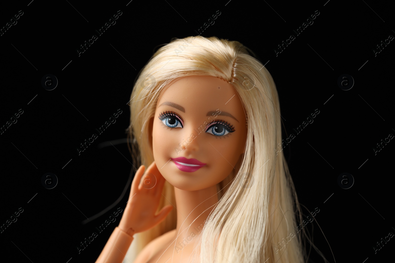 Photo of Mykolaiv, Ukraine - September 1, 2023: Beautiful Barbie doll on black background