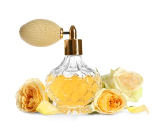 Photo of Bottle of luxury perfume and beautiful flowers isolated on white