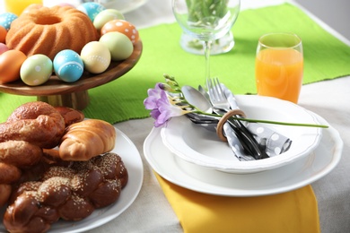 Photo of Festive Easter table setting with traditional meal