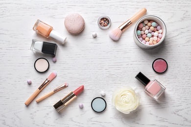 Photo of Flat lay composition with decorative cosmetics on light background
