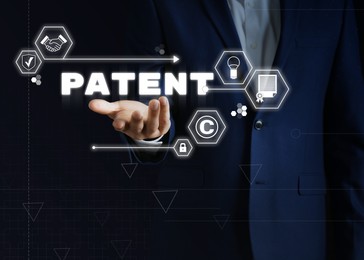 Image of Patent concept. Different virtual icons and man on dark background, closeup
