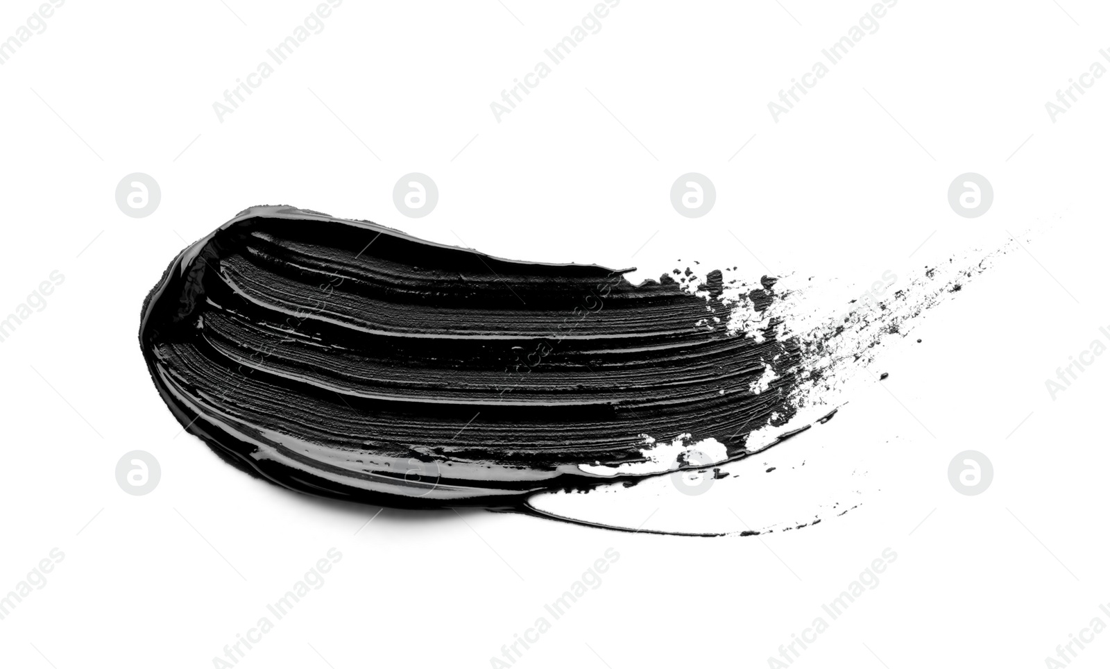 Photo of Brushstroke of black oil paint on white background, top view