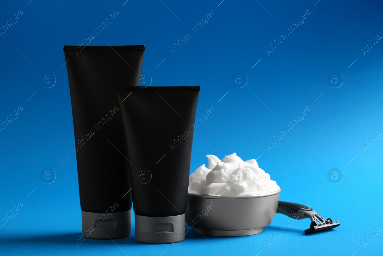 Photo of Set of shaving equipment and men's cosmetic products on color background