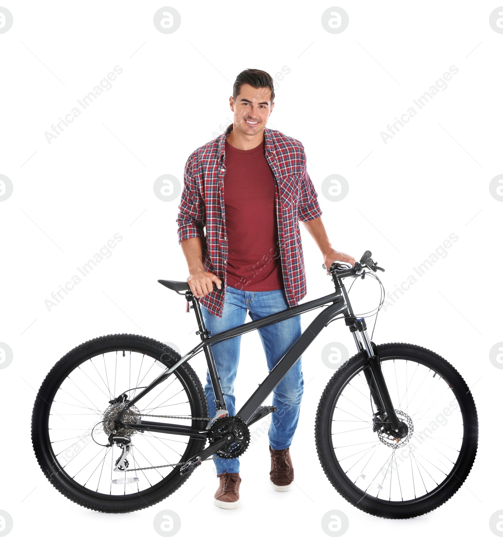 Photo of Handsome young man with modern bicycle on white background