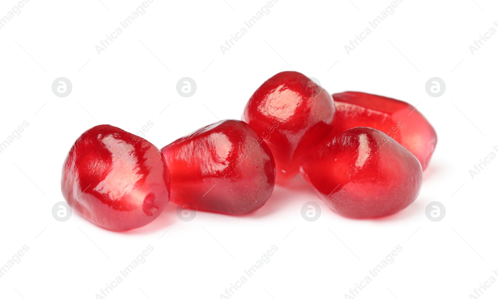 Photo of Juicy red pomegranate seeds on white background