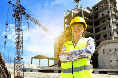 Image of Professional engineer in safety equipment at construction site