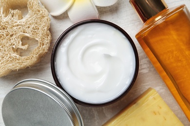 Photo of Flat lay composition with body care products on light background