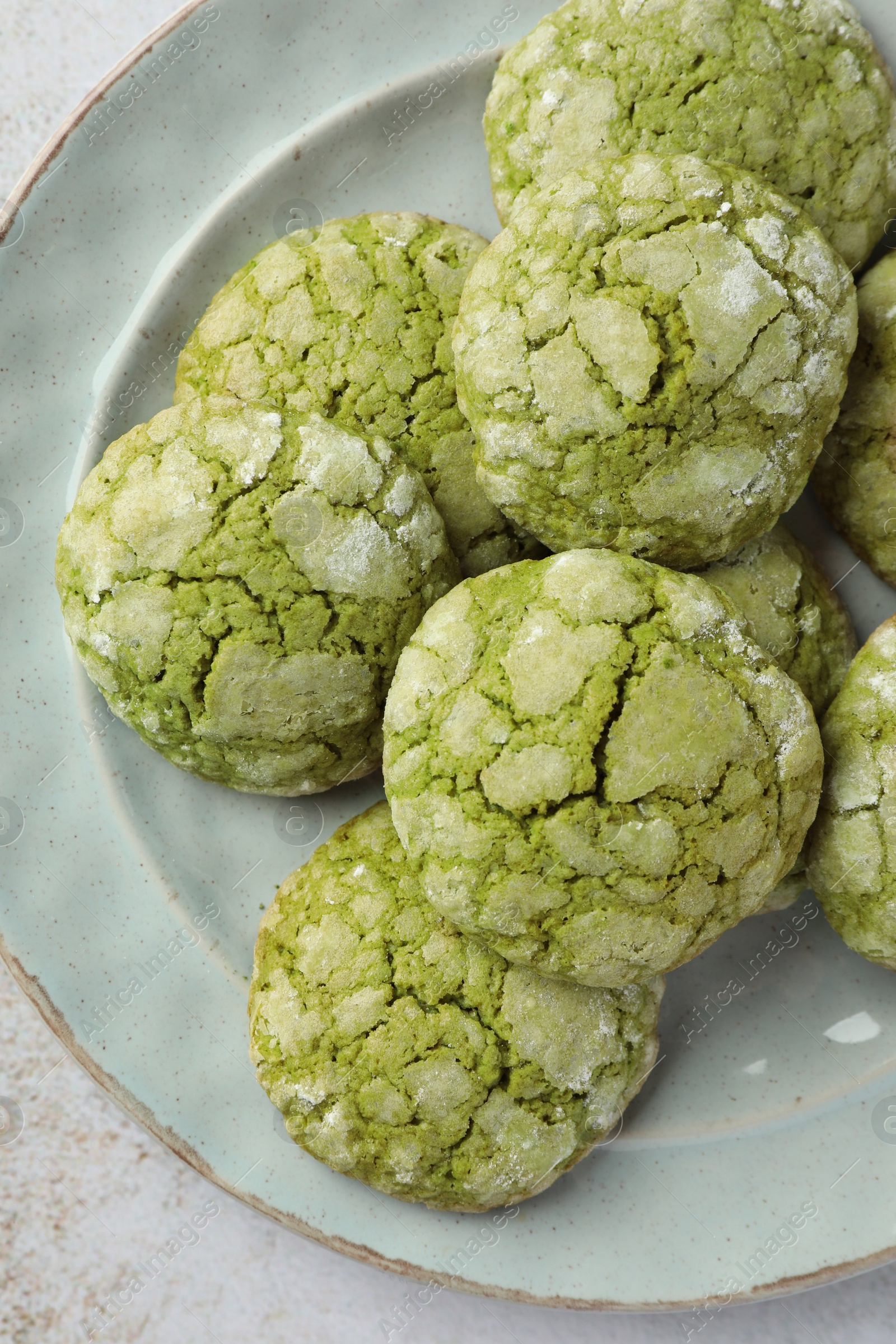 Photo of Plate with tasty matcha cookies on table, top view