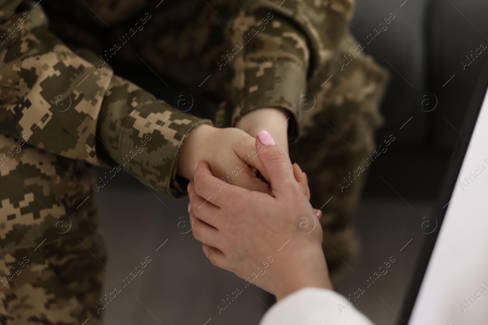 Photo of Psychotherapist working with military woman in office, closeup