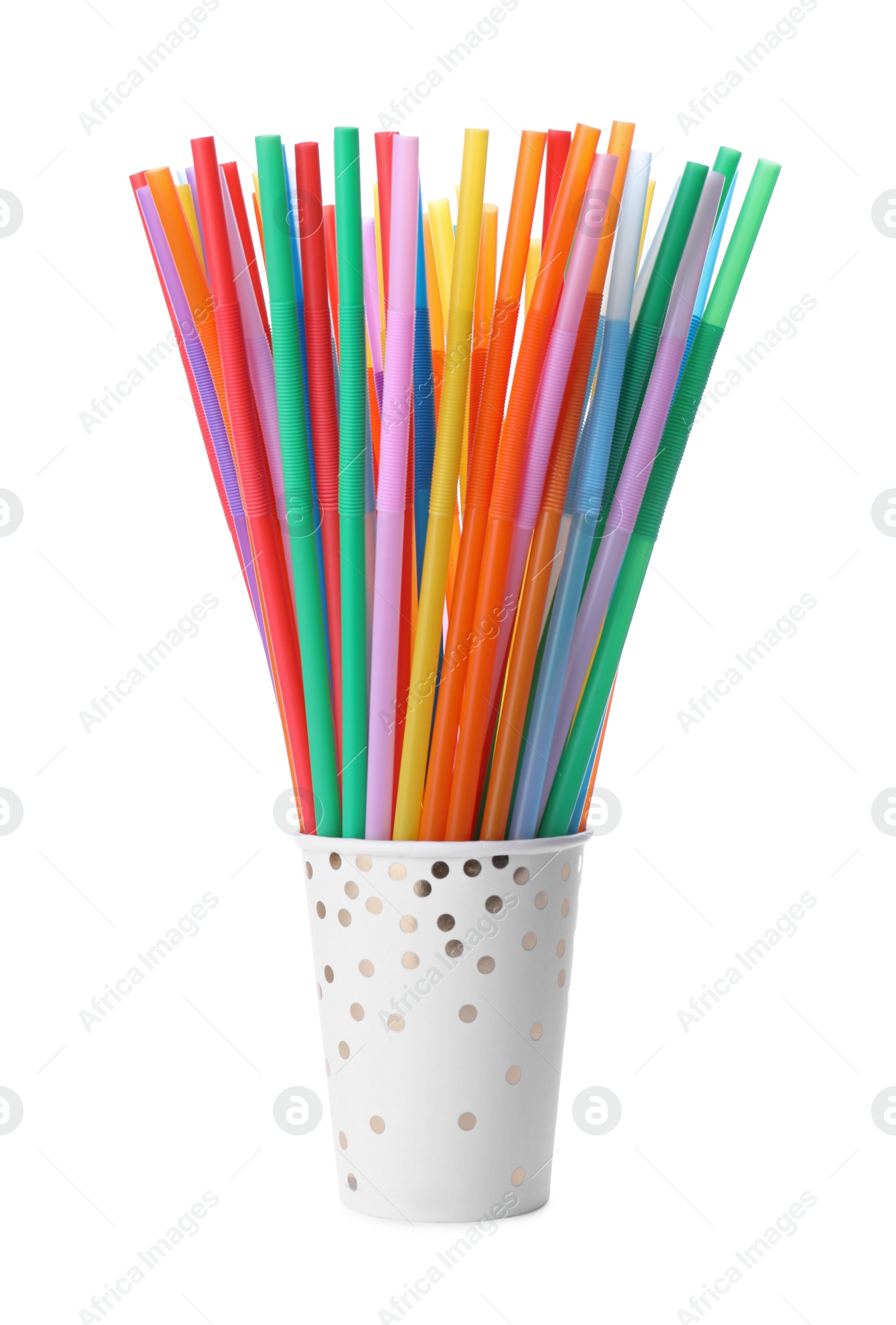 Photo of Paper cup with many colorful cocktail straws on white background