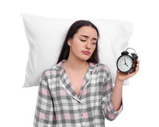 Photo of Tired young woman with alarm clock and pillow on white background. Insomnia problem